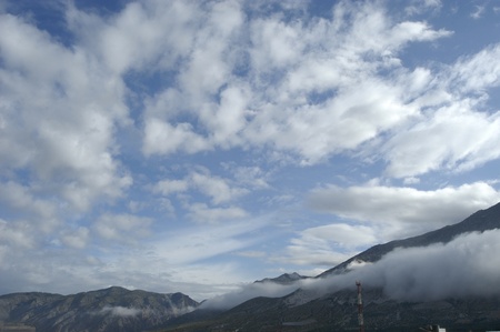 view lecrin valley to the sierra nevada in the background with low cloudsの写真素材