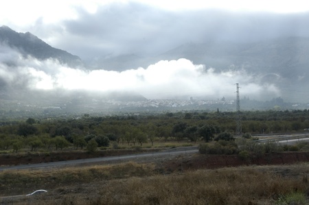 view lecrin valley to the sierra nevada in the background with low cloudsの写真素材