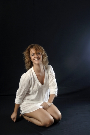 smiling young woman in shirtの写真素材