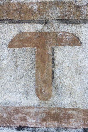 typography painted on vintage walll, letter tの写真素材