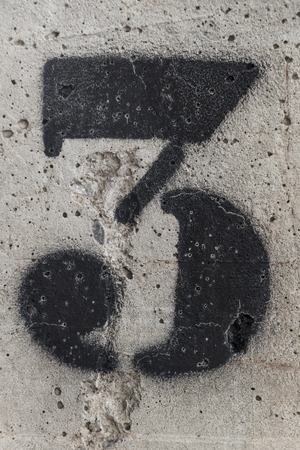 number three painted stencil on concrete wall, number three, number 3
