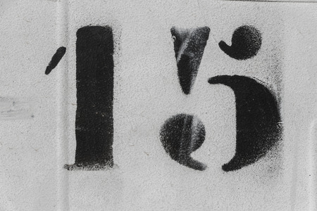 number 15 black spray paint on white background, number fifteenの写真素材