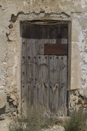 old wooden door,old door, old wood and metal door in Spanish villageの写真素材