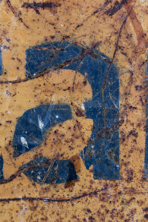 blue letter scratched rusty metal texture, blue stencil painted on rusty background, letter aの写真素材