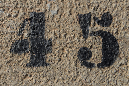 number forty five painted stencil on concrete wall, number 45