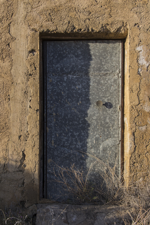 old metal door, old wood and metal door in Spanish villageの写真素材