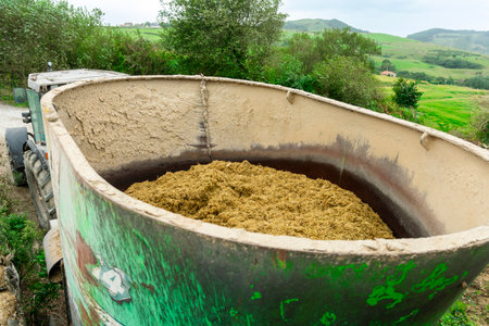 Tractor trailer carrying hay for animal feedの写真素材