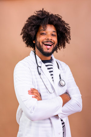 Black doctor smiling and laughing in lab coat with stethoscope representing healthcare and medical