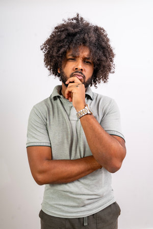 Young man thinking with a thoughtful expression for a new idea