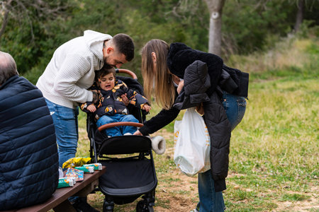 Parents attending to their distressed toddler sitting in a stroller outdoors