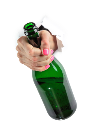 Hand isolated. Bottle in the girls hand.の写真素材