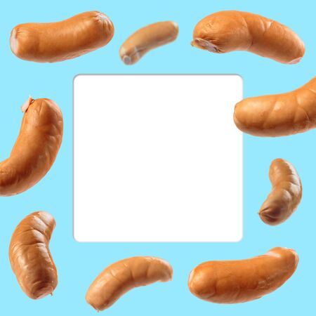 azure-blue menu frame with flying smoked wienersの写真素材