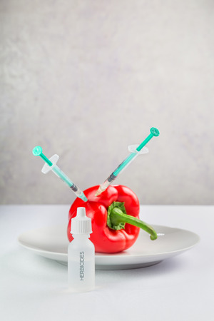 Fresh juicy vegetables on a plate, treated with chemicalsの写真素材