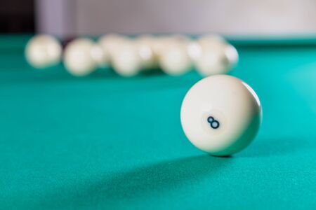 balls for Russian Billiards on a billiard table with a green cloth