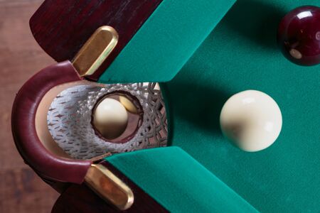 balls for Russian Billiards on a billiard table with a green clothの写真素材