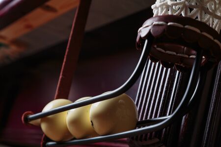 balls for Russian Billiards on billiard table with a green cloth scored in the pocket billiard ballsの写真素材