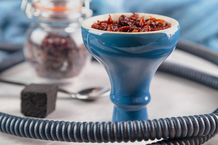 shisha with Apple flavor in glossy blue bowl, cooked for Smoking