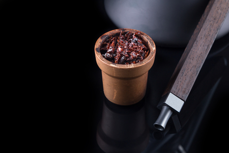 Modern hookah isolated on black background. Eastern smokable water pipe smoking on black background.
