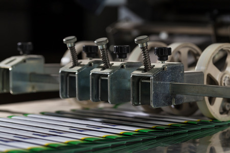 Folding machine industrial. Demonstration of the workflow. Equipment for color printing.の写真素材