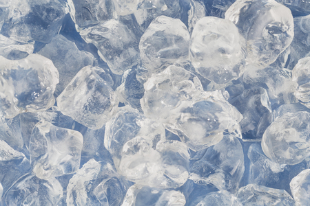 Frozen ice cubes for cocktails. Background with ice cubes. Selective focus