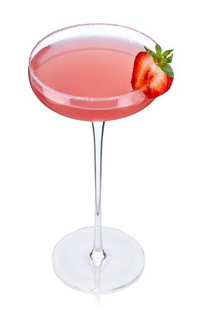 Margarita cocktail in a beautiful glass with a high leg and half of fresh strawberries isolated on white. 100 percent sharpness. Quality image. Vertical.の写真素材