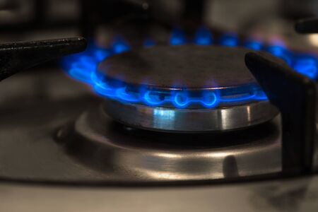Blue flame of gas on a cookerの写真素材