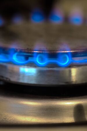 Blue flame of gas on a cooker. Vertical image.