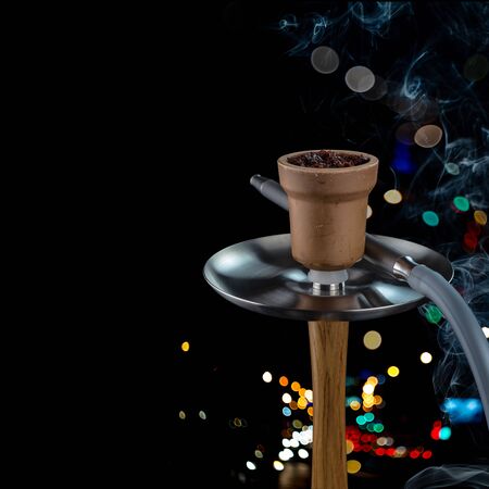 Modern hookah for Smoking, made in black from metal, glass and rubber. Luxury version of hookahs.の写真素材