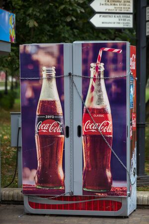 Closed showcase-fridge for soft drinks and the top tied with a chain in a public Park in Minsk, Belarus, 29.09.2019.のeditorial素材