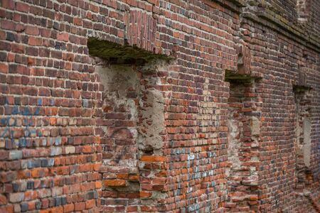 Old brick walls, damaged by war and time.