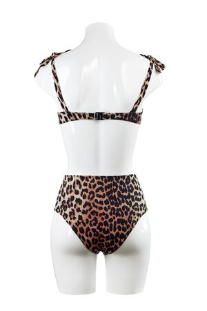 Women's swimsuit leopard-colored bikini isolated on a white background on an mannequin.