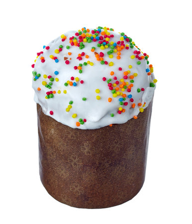 Easter cake, with white sweet glaze, sprinkled with colored crumbs, wrapped in traditional paper, isolated on a white background.の写真素材