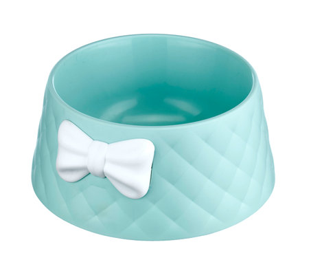Beautiful bowl for animals, empty, made of plastic, decorated with a bow, isolated on a white background.の写真素材