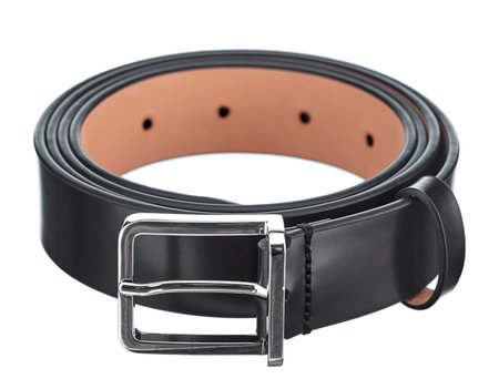 Perfect mens black leather trouser belt, with a classic metal buckle, rolled into a ring, isolated on a white background.の写真素材