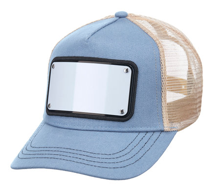 Cotton cap in light-blue colors, with a visor, with a white metal plate in front and a beige ventilated mesh at the back, isolated on a white background.の写真素材