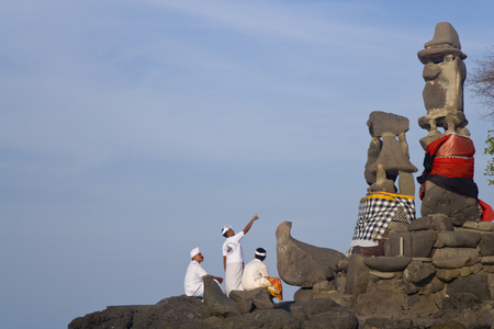 North West Bali, Indonesia - September, 2007: Men worshiping at Paben temple by the seaのeditorial素材