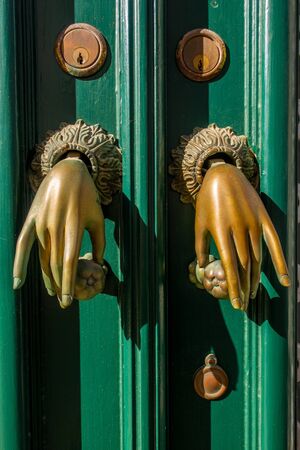 Door knockers in the form of hands, Algarve, Portugalの写真素材