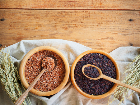 Thailand jasmine  brown rice in wooden bowl with copy spaceの写真素材