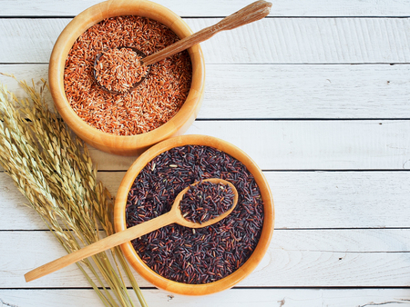 Thailand jasmine  white and brown rice in wooden bowl with copy spaceの写真素材