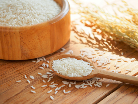 Thailand jasmine  white rice in wooden spoonの写真素材