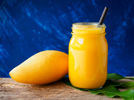 Mango smoothies in glass in summer seasonの写真素材