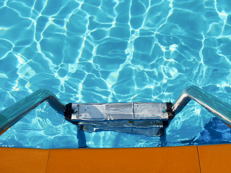 Ladder in swimming pool for summer vacation concept with copy space.の写真素材