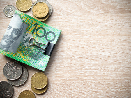 Dollar australia banknotes and coins on wooden table with copy space for money concept.の写真素材