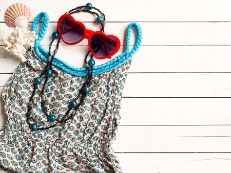 summer holiday  items,Beach accessories on blue wooden background with copy space for vacation concept.の写真素材