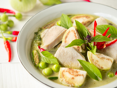 Chicken green curry with eggplant, sweet basil and hot chili  famous traditional  Thai food.の写真素材