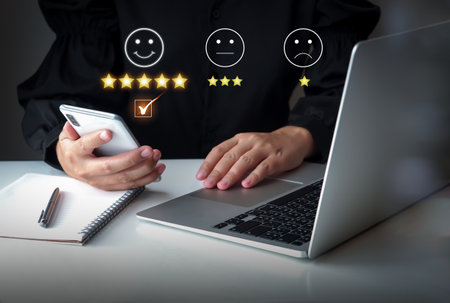 Satisfaction and consumer feedback concept. Clients use smartphone for rating excellence to customer...