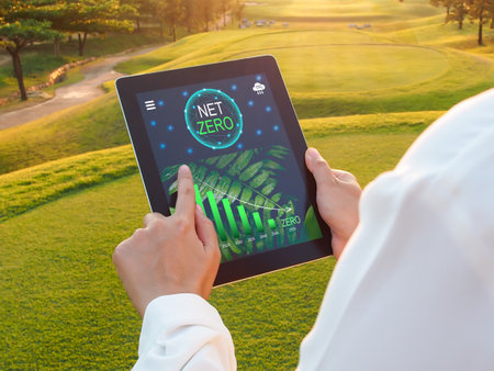 Net zero, Carbon neutral, emission reduction target. Businesswoman using tablet to see net zero carbon emission goal in 2050.の写真素材