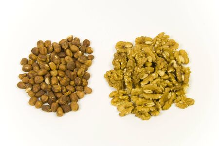 pile of hazelnuts and walnuts prepared for eating raw or bakingの写真素材