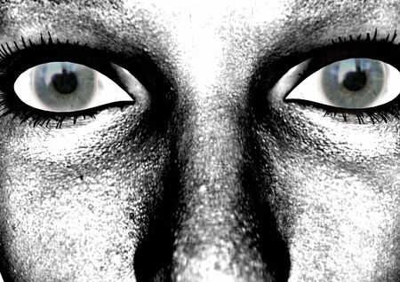 dark green staring eyes with black eyelashesの写真素材