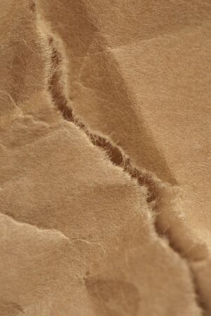 old brown torn abstract paper backgroundの写真素材